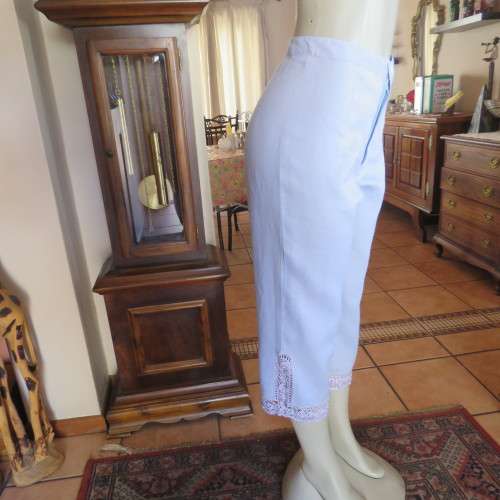 Fabulous cropped powder blue high waist pants crochet decoration on legs. Size 34/10 New condition.