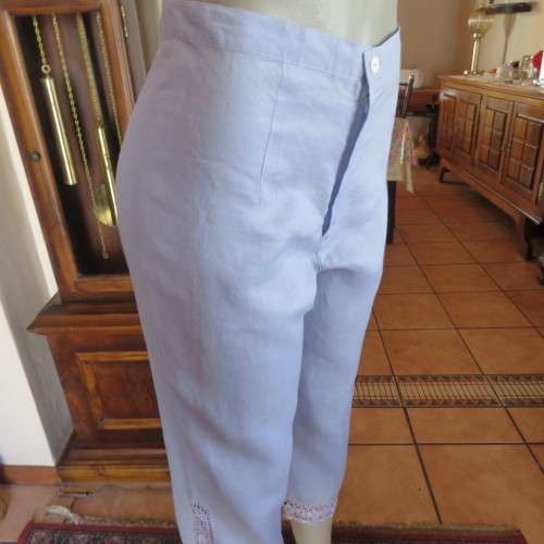 Fabulous cropped powder blue high waist pants crochet decoration on legs. Size 34/10 New condition.