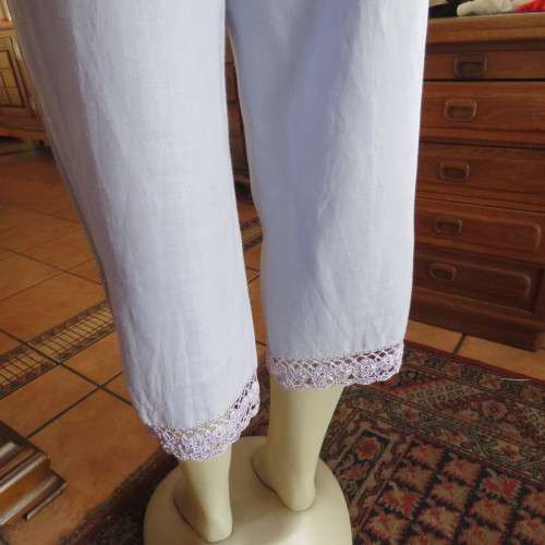 Fabulous cropped powder blue high waist pants crochet decoration on legs. Size 34/10 New condition.