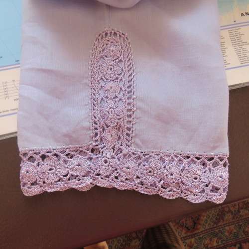 Fabulous cropped powder blue high waist pants crochet decoration on legs. Size 34/10 New condition.