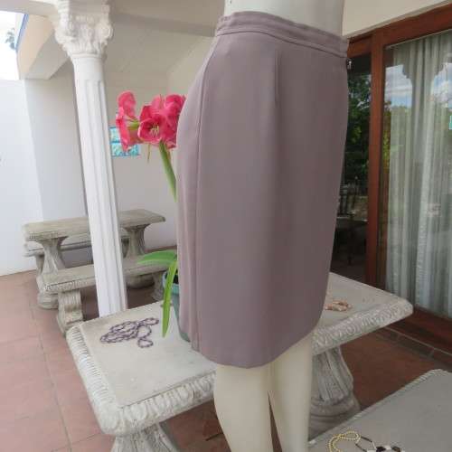 Smart medium brown knee length pencil skirt. Zip at back. Size 38/14 by DIJON. New condition.