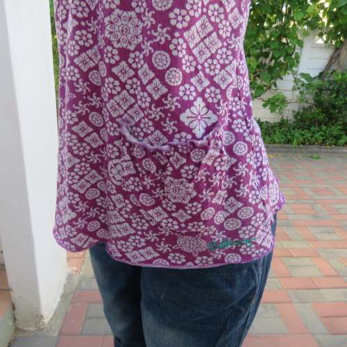 As new`Billabong`strappy top in size 38/14. In violet and white floral pattern.Unique strappy detail