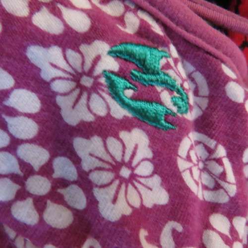 As new`Billabong`strappy top in size 38/14. In violet and white floral pattern.Unique strappy detail