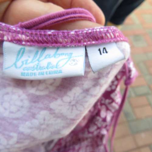 As new`Billabong`strappy top in size 38/14. In violet and white floral pattern.Unique strappy detail