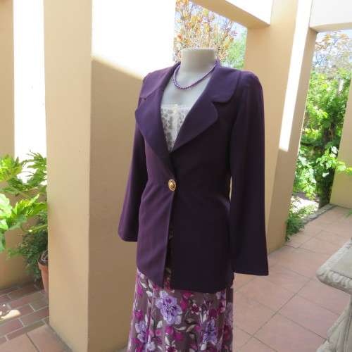 Elegant dark purple long sleeve jacket. Fully lined. By `Truworths`. In size 32/8. New condition.