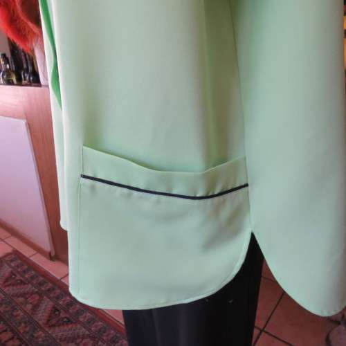 Lime green short sleeve top. Round collar. Size 46 to 48. By . Good condition.