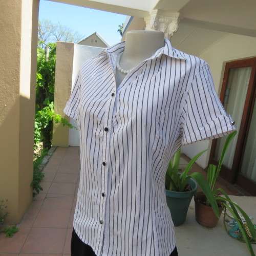 Black and white vertical striped top. Button down front. By `Insync Formal`. Size 38/14. As new.