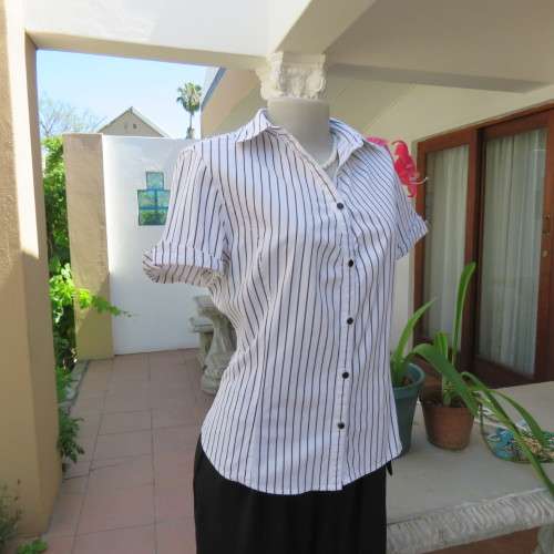 Black and white vertical striped top. Button down front. By `Insync Formal`. Size 38/14. As new.