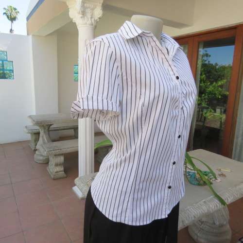 Black and white vertical striped top. Button down front. By `Insync Formal`. Size 38/14. As new.