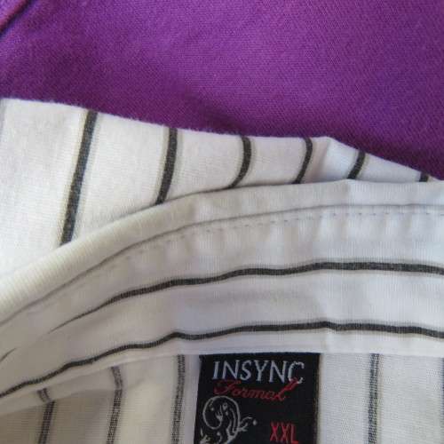 Black and white vertical striped top. Button down front. By `Insync Formal`. Size 38/14. As new.