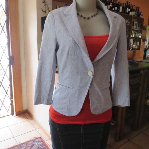 Chic tailored long sleeve jacket. In fine white and blue vertical stripes. Size 30/6. As new.