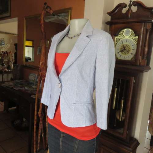 Chic tailored long sleeve jacket. In fine white and blue vertical stripes. Size 30/6. As new.
