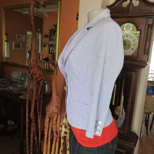 Chic tailored long sleeve jacket. In fine white and blue vertical stripes. Size 30/6. As new.