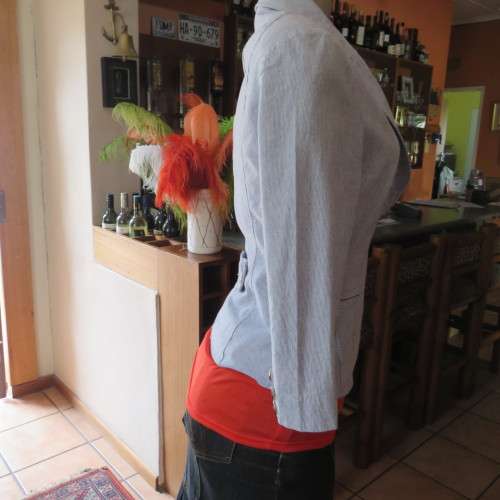 Chic tailored long sleeve jacket. In fine white and blue vertical stripes. Size 30/6. As new.