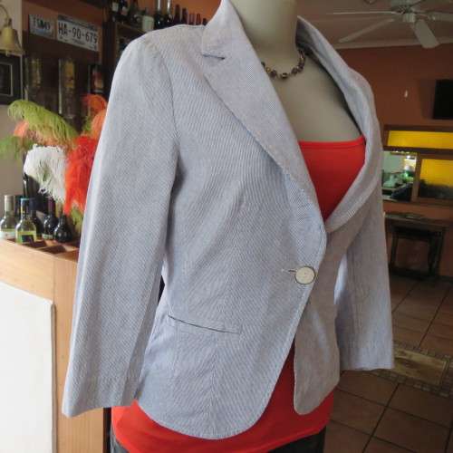 Chic tailored long sleeve jacket. In fine white and blue vertical stripes. Size 30/6. As new.