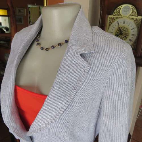 Chic tailored long sleeve jacket. In fine white and blue vertical stripes. Size 30/6. As new.