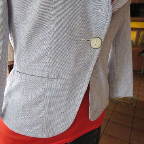 Chic tailored long sleeve jacket. In fine white and blue vertical stripes. Size 30/6. As new.