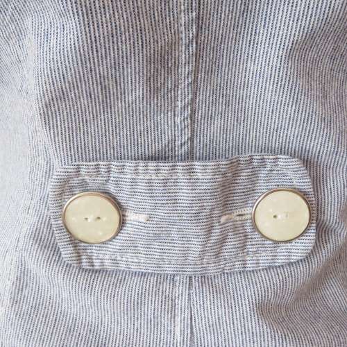 Chic tailored long sleeve jacket. In fine white and blue vertical stripes. Size 30/6. As new.