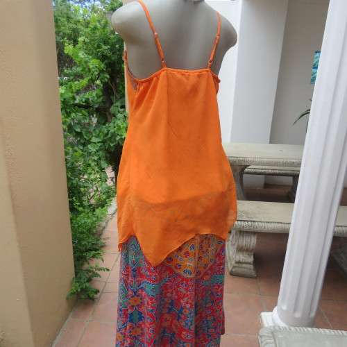 Lovely bright orange top. Thin adjustable straps. Pointed hemline. Size 36/12 by ` Shenga`. As new.
