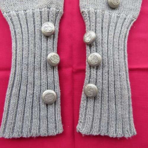 Pretty acrylic knitted fingerless light grey gloves with silver thread. Size Medium. New condition.