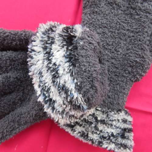 Women`s dark grey stretch polyester gloves with grey and white cuffs. Size medium to large. As new.
