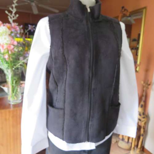 Warm black suede look  zip-up waistcoat. Polyester inner. Size 36/12 by `Woolworths`. New condition.