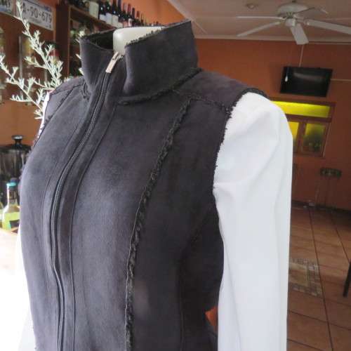 Warm black suede look  zip-up waistcoat. Polyester inner. Size 36/12 by `Woolworths`. New condition.