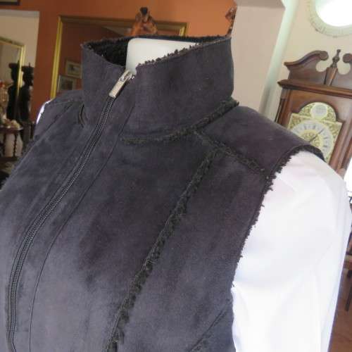 Warm black suede look  zip-up waistcoat. Polyester inner. Size 36/12 by `Woolworths`. New condition.
