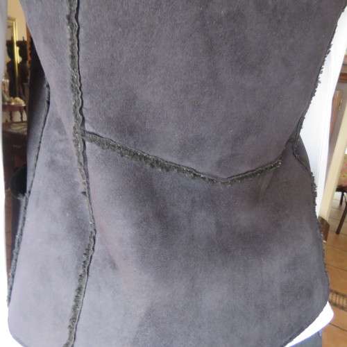 Warm black suede look  zip-up waistcoat. Polyester inner. Size 36/12 by `Woolworths`. New condition.