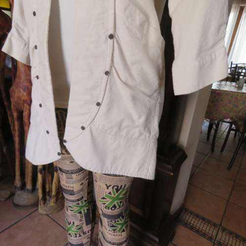 Striking long open jacket in natural textured cotton. By `Laid Back`. Size 34 to 38. New condition.