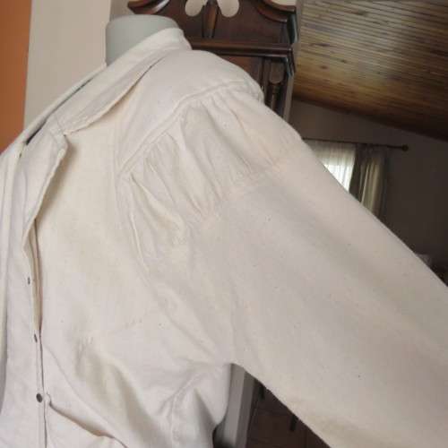 Striking long open jacket in natural textured cotton. By `Laid Back`. Size 34 to 38. New condition.