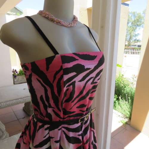 Up style sexy summer dress with pink, white and black print with belt. Size 34/10. New condition.