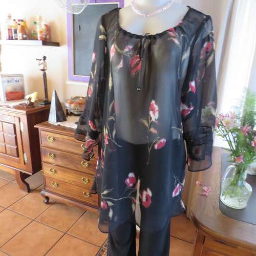 Sheer black top with pink floral pattern by `Topics` size 42/18. Used but fine for everyday use.