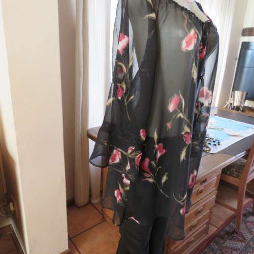 Sheer black top with pink floral pattern by `Topics` size 42/18. Used but fine for everyday use.