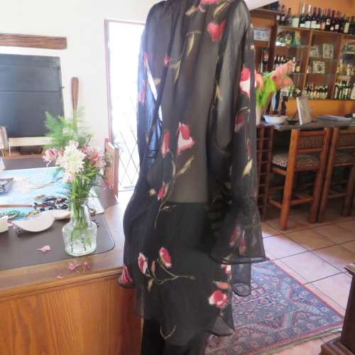 Sheer black top with pink floral pattern by `Topics` size 42/18. Used but fine for everyday use.