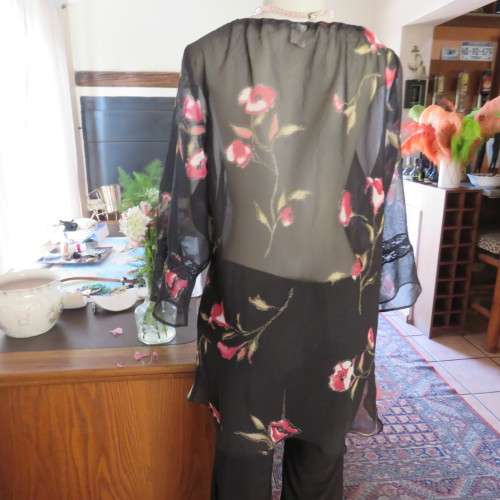 Sheer black top with pink floral pattern by `Topics` size 42/18. Used but fine for everyday use.