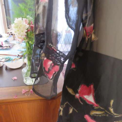 Sheer black top with pink floral pattern by `Topics` size 42/18. Used but fine for everyday use.