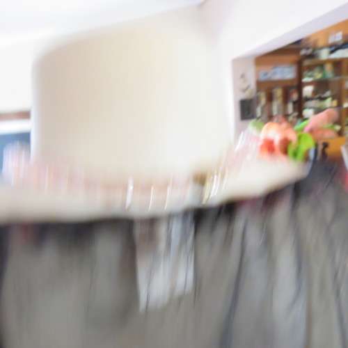 Sheer black top with pink floral pattern by `Topics` size 42/18. Used but fine for everyday use.