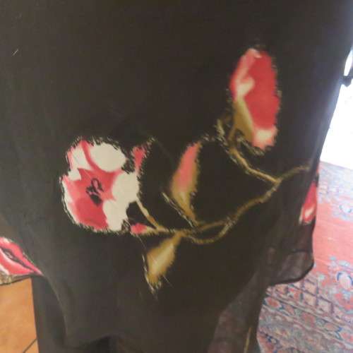 Sheer black top with pink floral pattern by `Topics` size 42/18. Used but fine for everyday use.