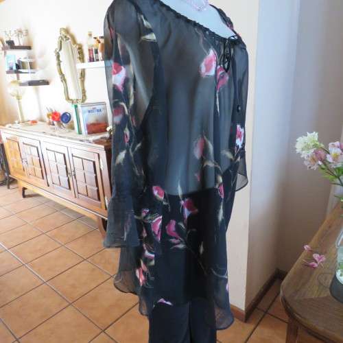 Sheer black top with pink floral pattern by `Topics` size 42/18. Used but fine for everyday use.