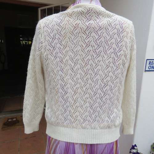 Lace pattern knitted cardigan in light cream colour by WOOLWORTHS in size 34/10. Very good cond.