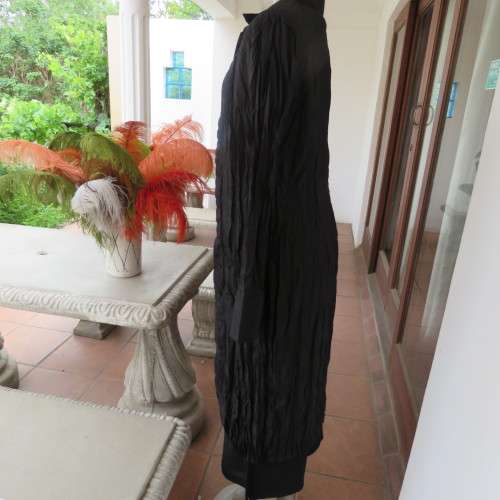 Make a statement with this black long sleeve summer coat in creased polyester. By WWW size 32/8