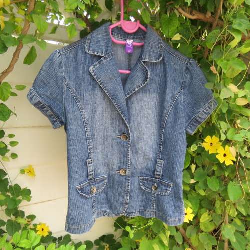 Capped sleeve blue denim jean jacket for 13 to 14 yr old girl.Two small dummy pockets. As new.