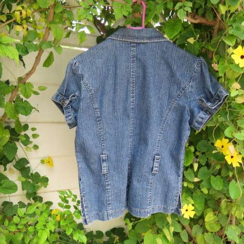 Capped sleeve blue denim jean jacket for 13 to 14 yr old girl.Two small dummy pockets. As new.