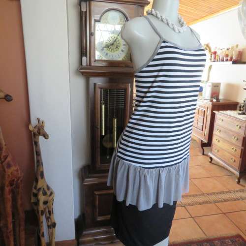 Sexy long strappy top in horizontal black + white stripes. Size 38/14 by `FV COLLECTION`.As new