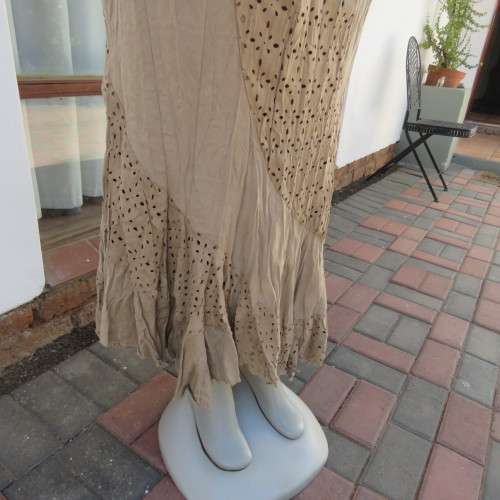 Stunning dark beige creased rounded ankle length skirt with asymetrical seamline size 42/18. As new.