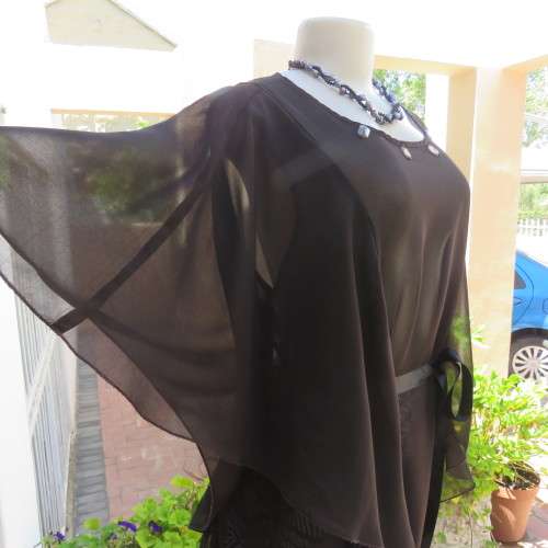 Pretty soft Flowing sheer polyester top in black. Size 40/16. Overlay loose sleeves. As new.