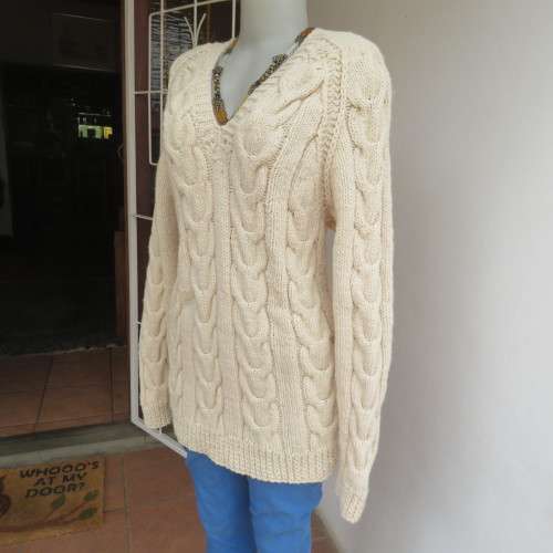 Bulky rich cream double knit long cable knit pullover sweater. Size 36/12. New condition.