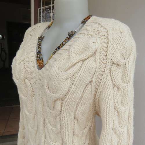 Bulky rich cream double knit long cable knit pullover sweater. Size 36/12. New condition.