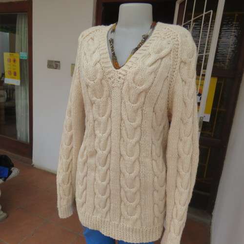 Bulky rich cream double knit long cable knit pullover sweater. Size 36/12. New condition.
